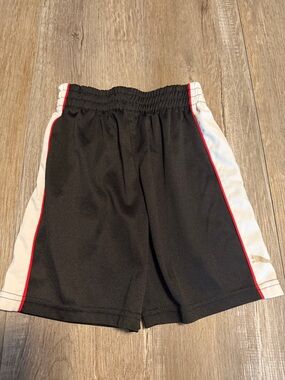 Puma Black Athletic Shorts with White Label and Red Piping Detail